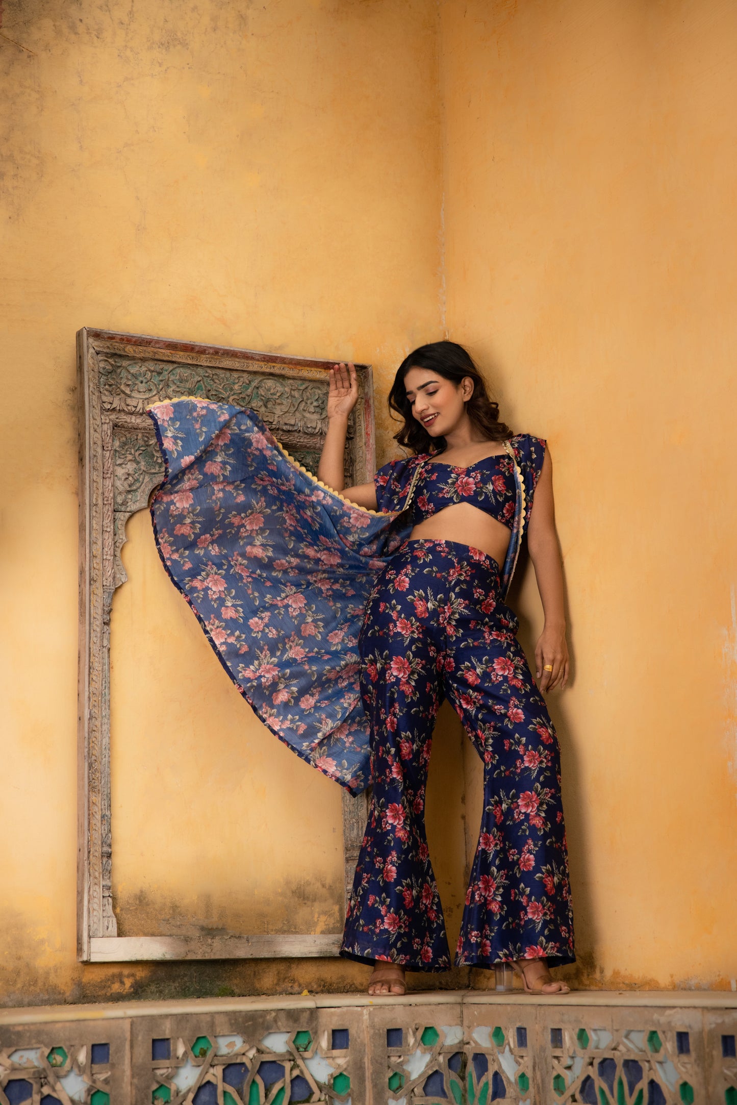 CLARA FORD BLUE FLORAL PRINTED CAPE WITH FLARED PANTS AND BUSTIER Deasha India